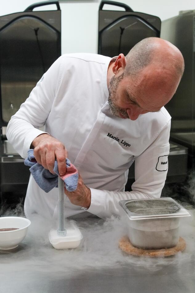 Martin Lippo working over liquid nitrogen, fog spilling across the bench